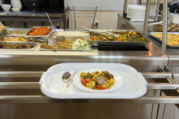 Self-service cafe. Serving table with food. 