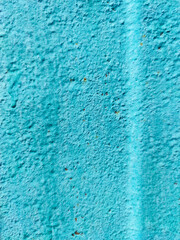 Fototapeta na wymiar Texture of thick old blue paint on a metal surface. Metal texture with scratches and cracks. Abstract background for design with copy space