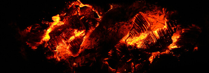 Hot ember and red heat burning wood or coals - barbecue backdrop