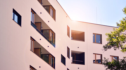Condominium and apartment building with  symmetrical modern architecture in the city downtown.