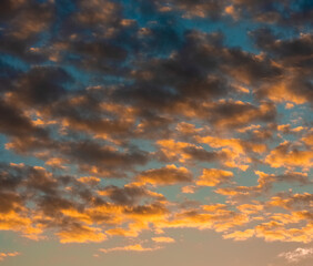 Clouds in the sky against the background of the sunset