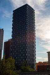 A shadow divides tall buildings