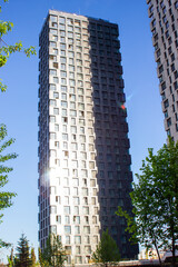 A shadow divides tall buildings