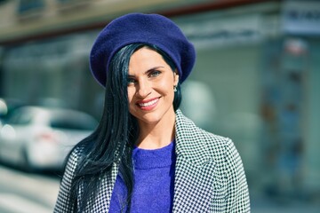 Young beautiful woman smiling happy wearing french style at the city.