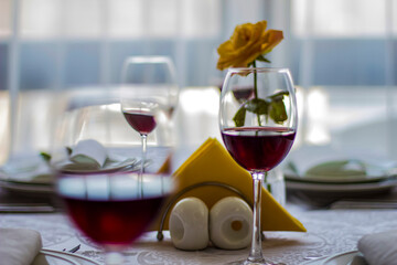 The table is ready for dinner. Red wine for a good appetite