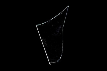 glass fragments in isolation on a black background. damaged window. damaged object