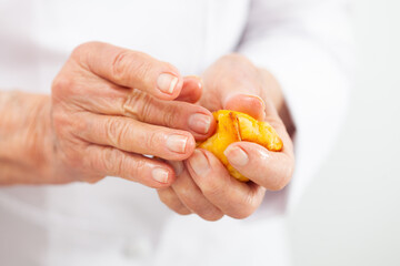 Senior woman preparing a traditional dish from el Valle del Cauca in Colombia called aborrajado