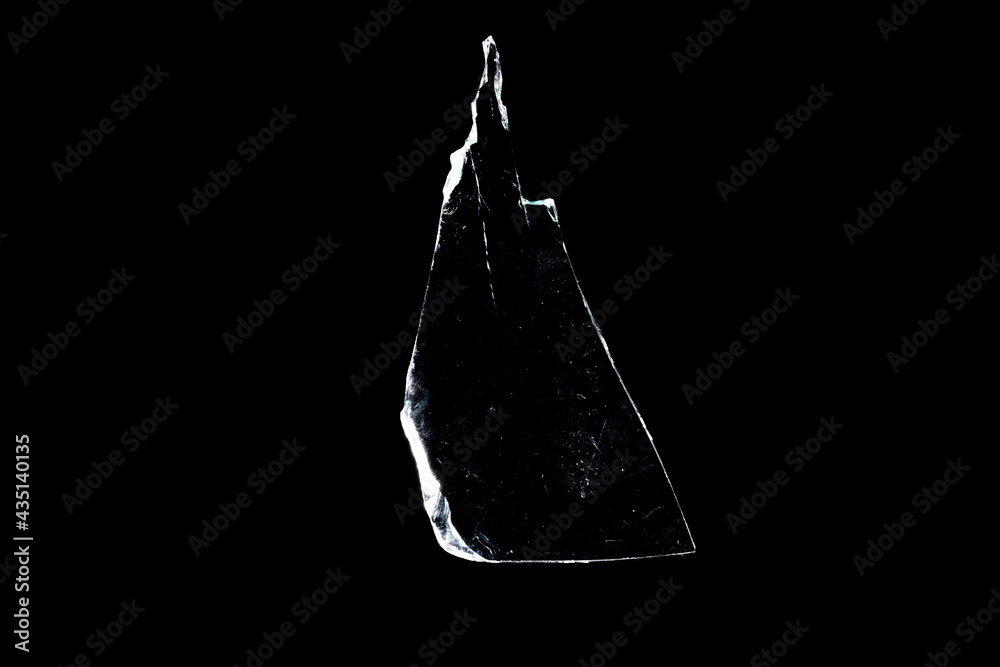 Wall mural glass fragments in isolation on a black background. damaged window. damaged object