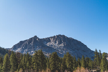 Fototapeta premium Beautiful Carson Peak above June Lake in Mono County California in Fall blue sky
