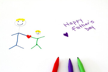 Kid's happy fathers day drawing and color pencils over white