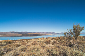 Mono lake, California in Autumn on sunny day with clear blue sky and tufa