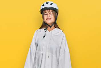 Teenager caucasian girl wearing bike helmet with a happy and cool smile on face. lucky person.