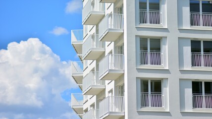 Condominium and apartment building with  symmetrical modern architecture in the city downtown.