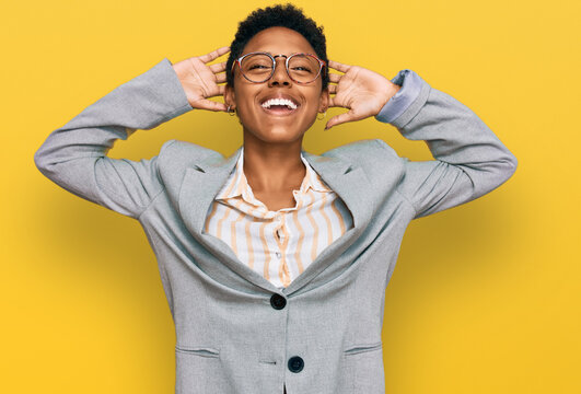 Young african american woman wearing business clothes relaxing and stretching, arms and hands behind head and neck smiling happy