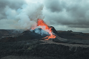 Giant volcano eruption with huge lava bursts in Iceland - obrazy, fototapety, plakaty