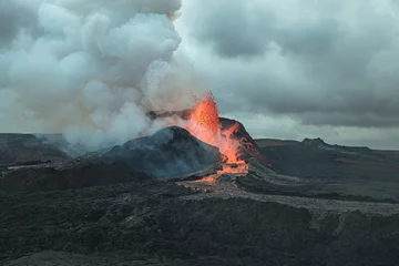 Fotobehang Huge volcano produces explosions of hot lava and magma in Iceland © Veniamin