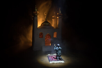Silhouette of mosque building on toned foggy background. Ramadan Kareem background. Mosque at...