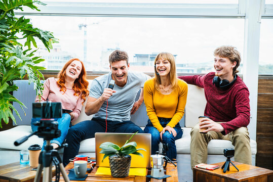 Millennial creative streamer group recording video broadcasting live on social media platforms - Young people having fun sharing viral videos online - New generation trends concept