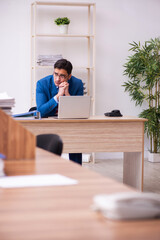 Young businessman employee working in the office