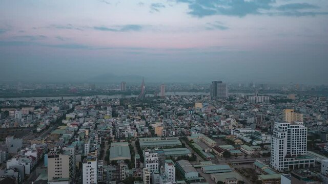 Time-Lapse view of industrialized city from dawn to morning with picturesque view of lights.