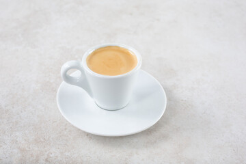 A view of an espresso drink with milk.