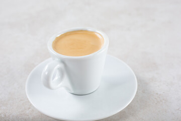 A view of an espresso drink with milk.