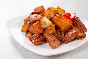 A view of a plate of roasted potatoes.