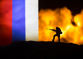Turkey small flag on burning dark background. Concept of crisis of war and political conflicts...