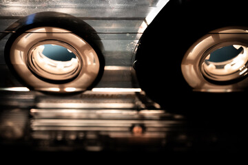 Abstract Angled Macro Closeup of Reels in Clear Cassette Tape