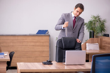 Young businessman employee in bullying concept in the office