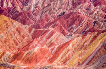 Rainbow Mountains China 
Candy-color mountains—with rippling stripes of cerulean blue, vibrant magenta, canary-yellow, & blood-orange— belong in a fairy tale, but in China, this is a reality. 
