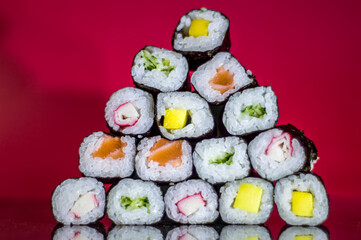 sushi pyramid with red background