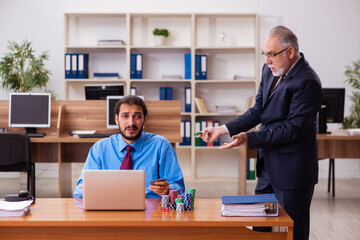 Two male employees in gambling concept