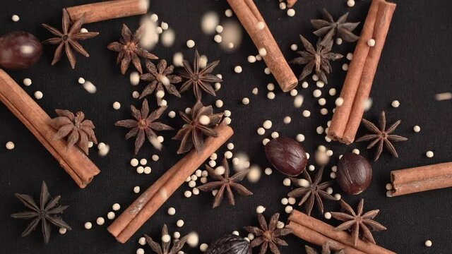 Close-up of stew and spice with black background, industrial concept.