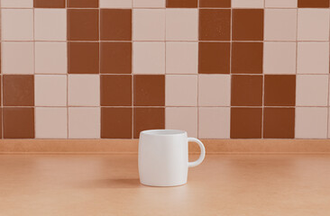 Single white coffee mug on a front view kitchen counter top with faience brown faience tiled wall, 3d Rendering, close-up view