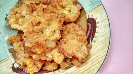 Indonesian Corn Fritters. traditional popular snack, crispy and crunchy food. Traditional Indonesian food, served on a plate