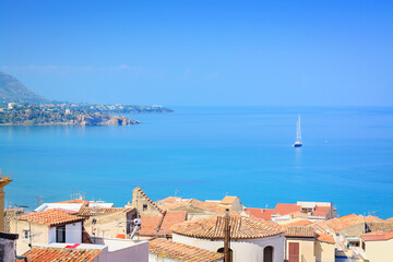 Sea views, tiled roofs and a sailboat in the distance