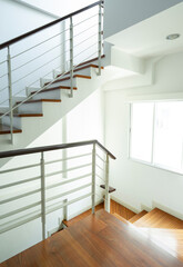 Fototapeta premium Wooden staircase and staircase railing handle for safety.