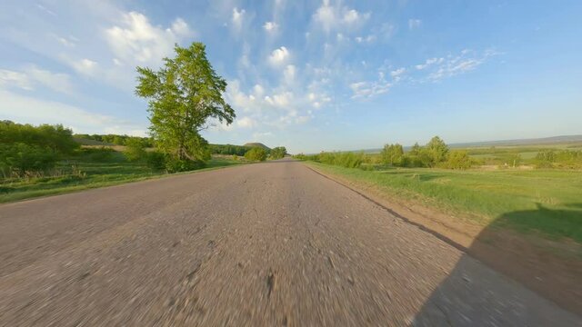 Shooting at high speed. A small paved track in the countryside. Travelling for short distances. High quality. 4k footage.