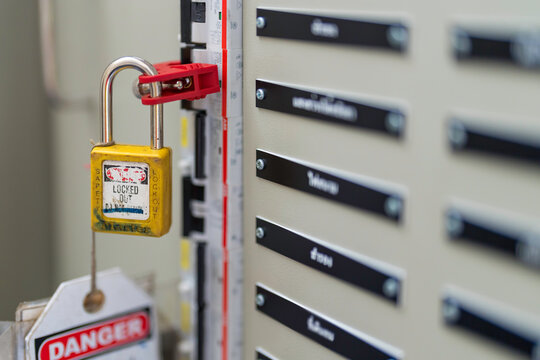 Lockout Tag-out. Working safety with electrical. Key lock circuit breaker at main distribution.