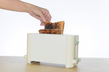 burnt bread toast in the toaster