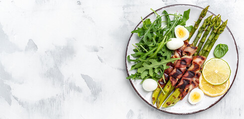 Grilled green asparagus wrapped with bacon. Ketogenic diet. Healthy food, diet banner, menu recipe place for text, top view