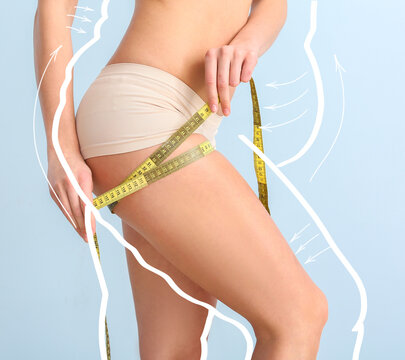 Young Woman With Measuring Tape After Weight Loss On Color Background