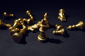 Chess pieces on dark background, closeup