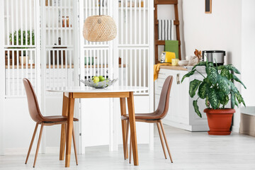 Interior of dining room with folding screen
