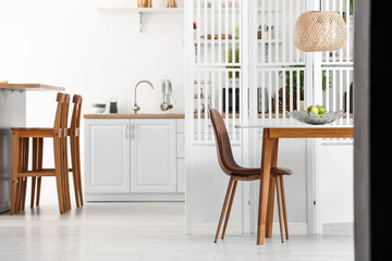 Interior of dining room with folding screen