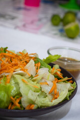 green leaf salad with carrots and lemon dressing