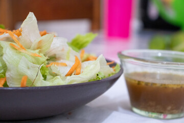 green leaf salad with carrots and lemon dressing