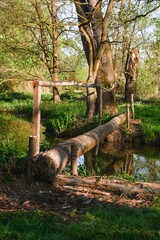 Footbridge over the water. In the morning at the lake Slanaky by the river Odra near Studenka. Northern Moravia. Czechia. Europe.