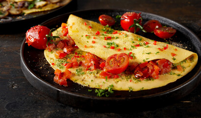 Delicious vegetarian omelet on table